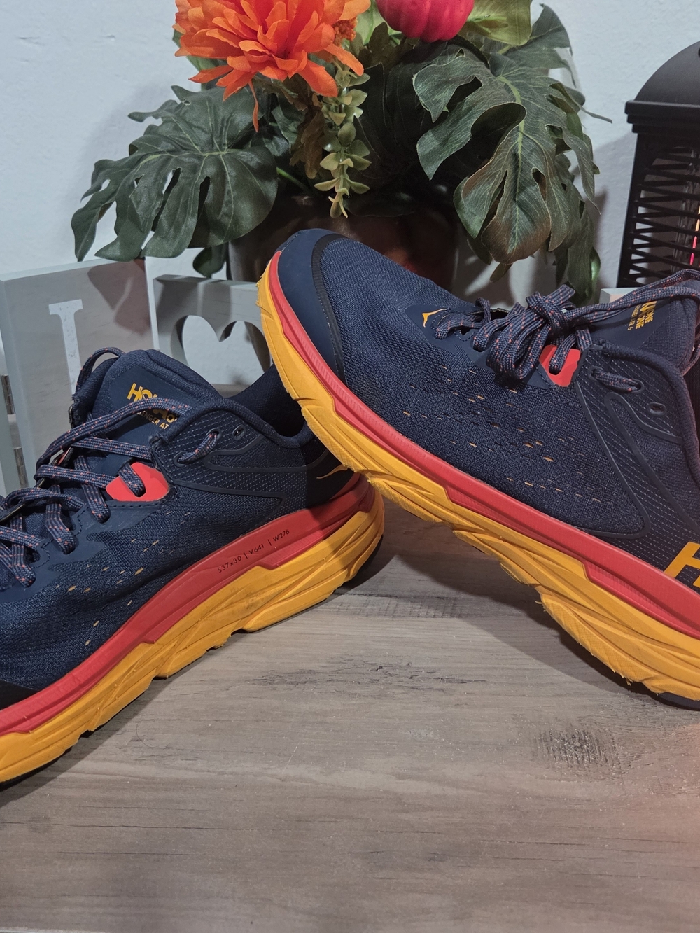 Hoka Navy Running Shoes with Yellow and Red Accents